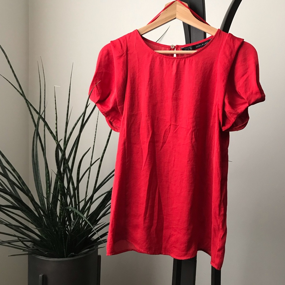Satiny red top with puff sleeves